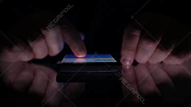 Close Up Image with Man Hands Using Smartphone Online Application in Dark