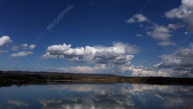 Dream clouds on the blue sky, timelapse landscape.