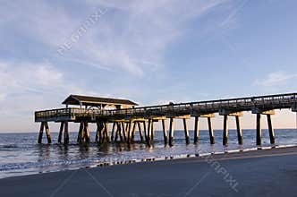 Tybee Island pier in Southern Georgia United States on the beach of the Atlantic Ocean, golden hour
