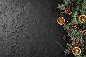 Christmas decoration on holiday background with Fir branches, pine cones, red decoration, spices. Xmas
