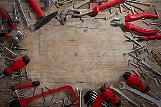 Colorful red hand tools in a DIY frame