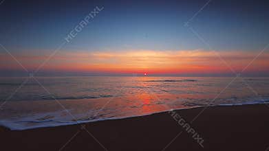 Tropic sunrise with dramatic clouds over the sea waves and beach, footage video