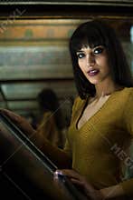 Beautiful Moroccan middle eastern Girl using information touch panel in room with mirrors