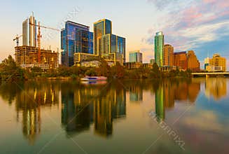 Austin, Texas with new buildings rising, reflecting in lady Bird Lake during sunset / Austin Skyline and new constructions