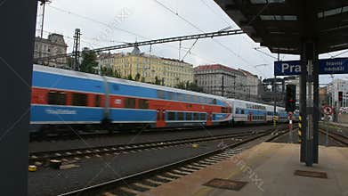 Passengers wait and to get on the train at Prague main railway station