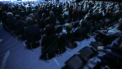 Speaker giving a talk on scientific conference. Audience at the conference hall. Business and entrepreneurship concept.