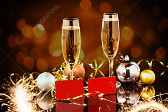 Christmas and New Year celebration with champagne. New Year holiday decorated table. Two Champagne Glasses