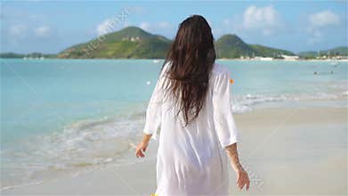 Follow me POV - Happy girl lookig at camera and smiling on the beach