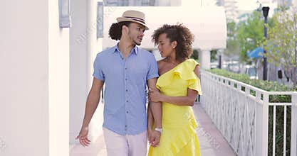 Woman kissing shoulder of boyfriend