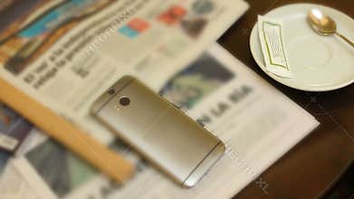 Business person drinking coffee and reading morning news in hotel lobby