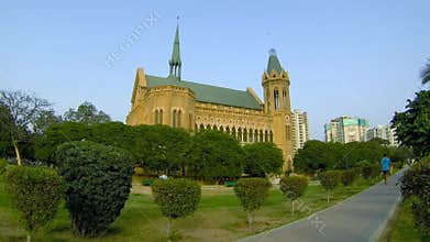 Man walks in Frere Hall Park, Karachi