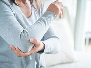 Closeup female`s elbow. Arm pain and injury. Health care and med