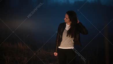 Portrait of Caucasian girl shocked and stressed. Beautiful frustrated female near foggy forest overwhelmed and lost.