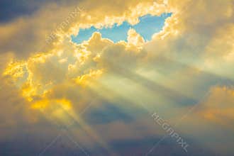 Sunbeam shining through the cloud in the valley. Evening sunset with sun rays through the clouds.