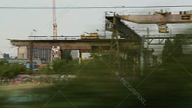Abandoned industrial area view from moving city train, post-soviet territory