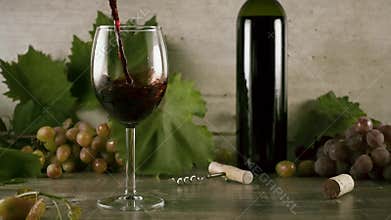 Slow motion wine is beautiful to pour into a glass of still life