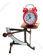 Red alarm bell on old letter scales
