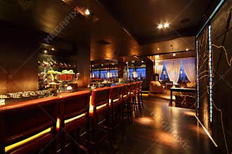 Bar counter with chairs in empty restaurant
