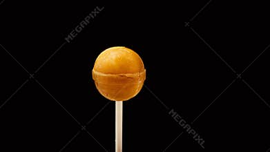 Colored candy lollipops on a black background. Close-up of baby candy