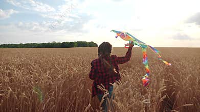 childhood dream concept happy family. kid girl run with a kite in a field of wheat. daughter lifestyle child play flying