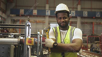 Smart strong happy worker work in heavy industry with wrench arm crossed smile