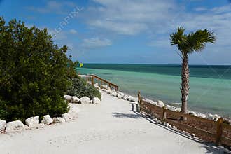 The view of the walking path overlooking the crystal clear blue water by the beach at Bahia Honda State Park, Big Pine Key,