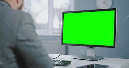 Businessman using chroma key pc