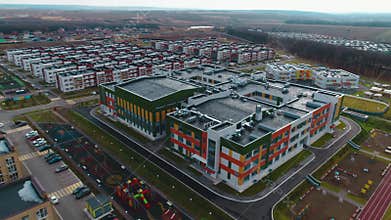 Large bright color school building and dwelling district