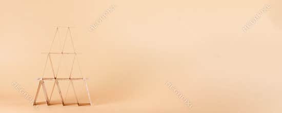 House of cards on long beige background