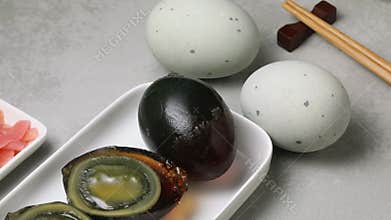 Whole and halved Chinese century eggs close up