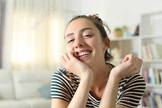 Candid woman smiling at camera at home