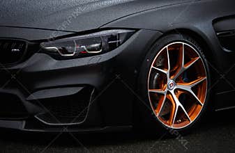 BMW M4 F83 wrapped in matte black vinyl wrap and equipped with custom wide body kit and forged wheels with low