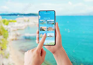 Girl chooses holiday destinations on smartphone