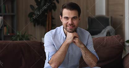 Happy young 30s confident man looking at camera.