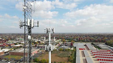 Aerial view of cellular wireless mobile data tower for mobile network. American suburban neighborhood