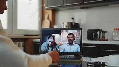 Close-up shot of Multiracial colleagues working home on quarantine by making common video call by computer