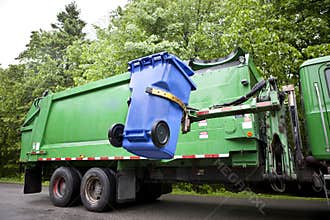 Recycling truck picking up bin - Horizontal