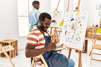 African american painter couple smiling happy painting at art studio