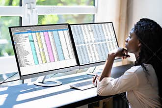 Data Analyst African Woman Using Spreadsheet