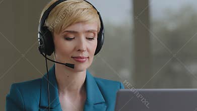 Adult mature 40s busy focused business woman operator manager help line agent call center support service wears headset