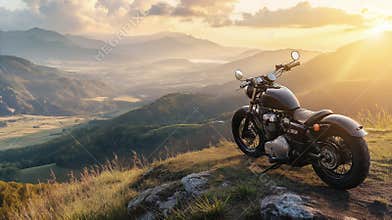 Black retro styled motorbike on the top of the hill with amazing sunset view on the valley below