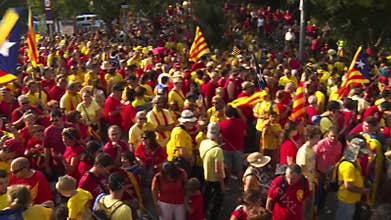 Crowd of People with Catalan Flags on the Street