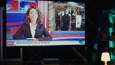 Journalist in newscast production talking about cybercriminals attacks subject, close up on smart TV
