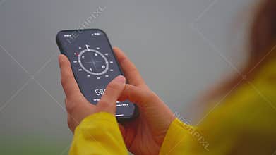 Woman using mobile compass online closeup. Concept of technology
