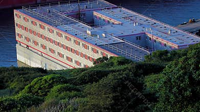 Bibby Stockholm barge, to house UK asylum seekers, evening light extreme close up. Portland, Weymouth, Dorset, England