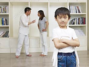 Asian boy and quarreling parents