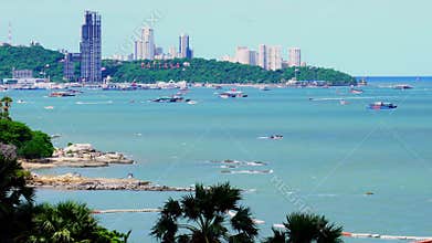Parasailing and other activities in Pattaya bay in the morning.