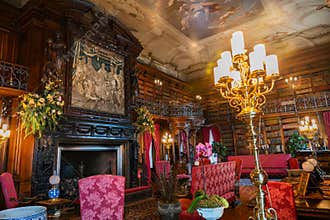 George Washington Vanderbilt Biltmore Estate. Gorgeous library room with original furniture, books, paintings and accessories.