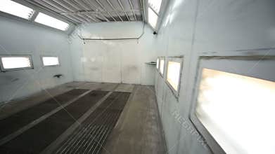 Lamps in wall of paint-spraying booth for cars at