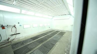 Entrance to paint-spraying booth with many lights